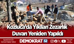 Kozluca’da yıkılan mezarlık duvarı yeniden yapıldı